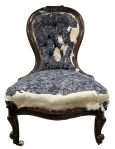 Fabric removed from the inner back and seat of the ladies chair
