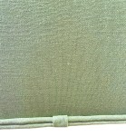 Double piping trim ends wrapped in fabric