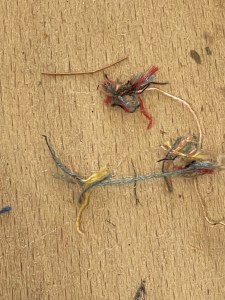 The mysterious tufts of colourful fabric