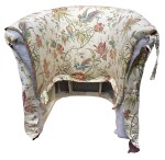 The chair needing the arm fronts covered