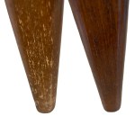 A chair leg before and after being stained.