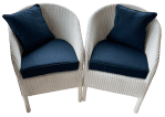 Plain chair cushions in situ on LLoyd Loom chairs.