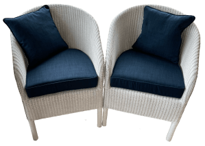 Plain chair cushions in situ on LLoyd Loom chairs.