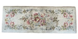 The fine but worn tapestry